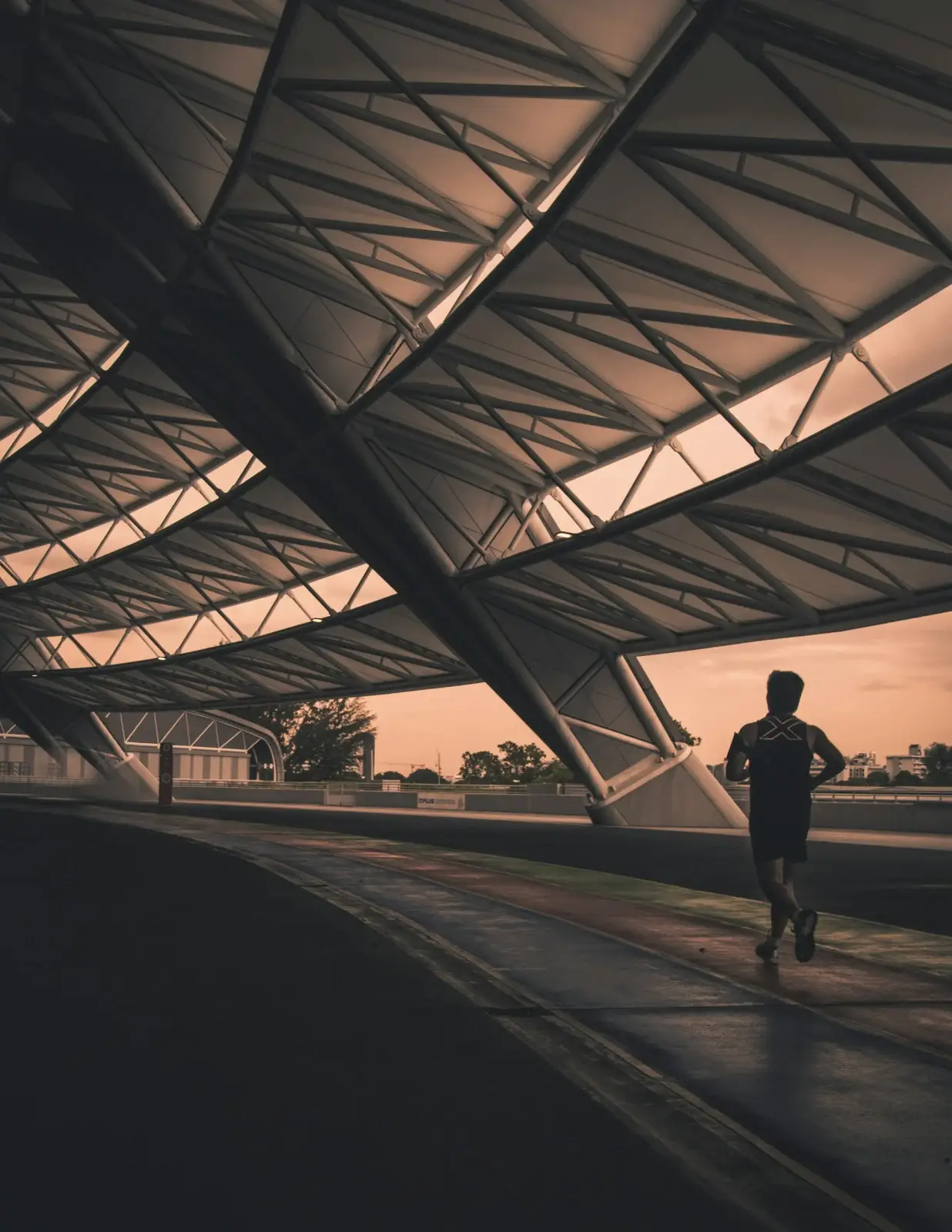 Runner beneath an architectural structure