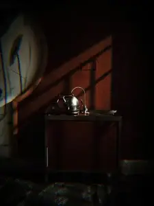 Kettle on a dark countertop in dramatic light