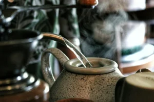 Water pouring into a ceramic vessel