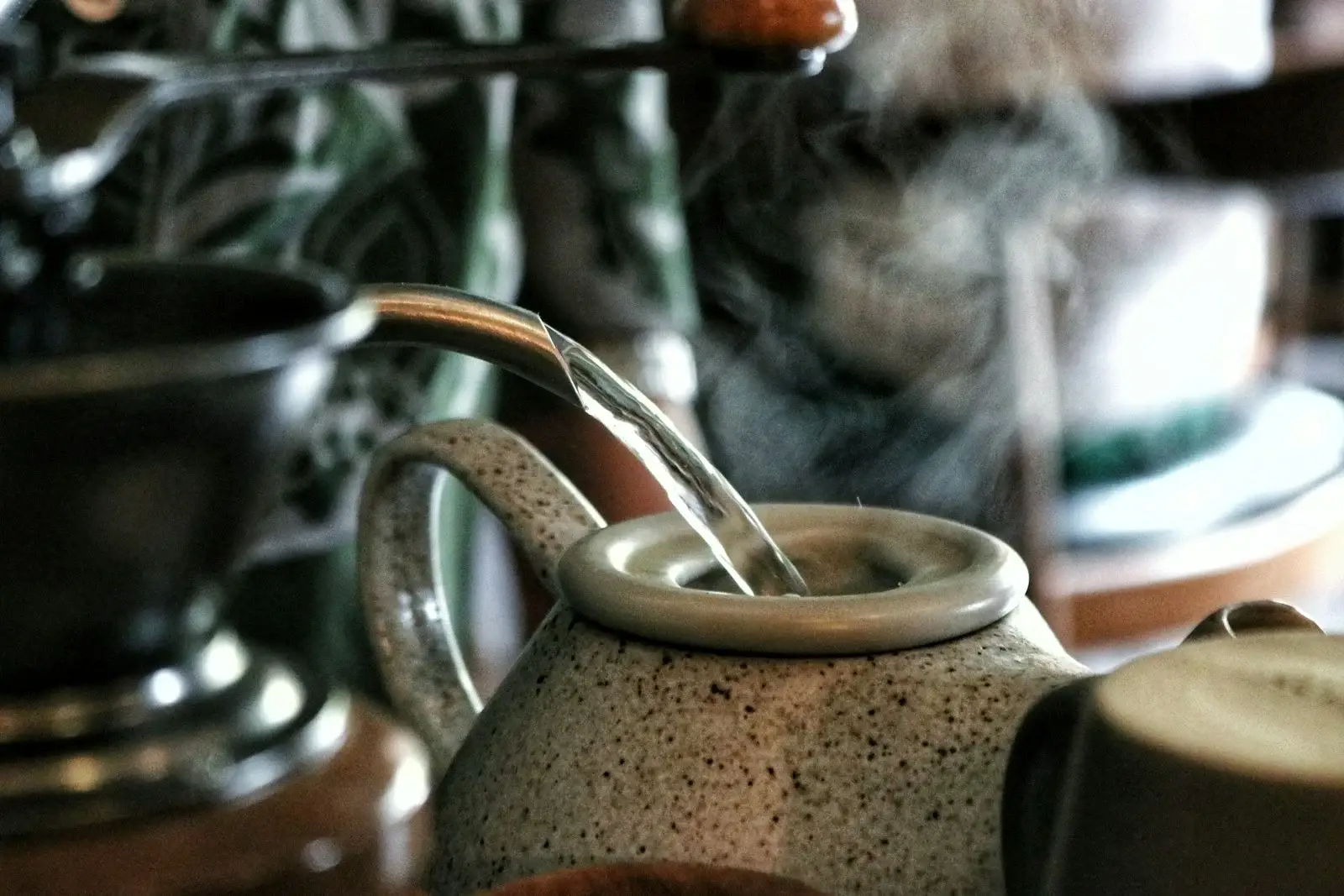 Water pouring into a ceramic vessel