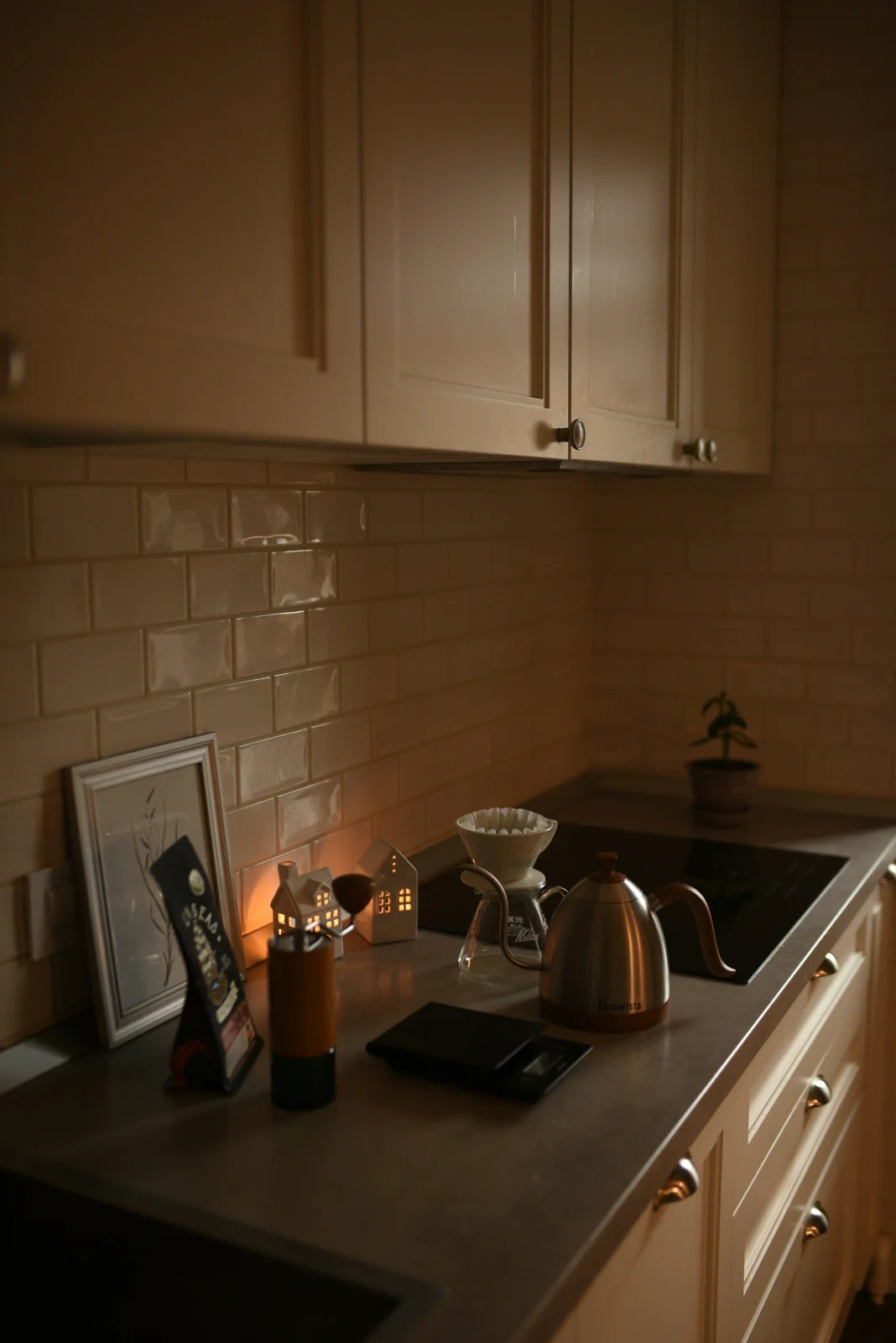 Kettle on a kitchen counter with warm light